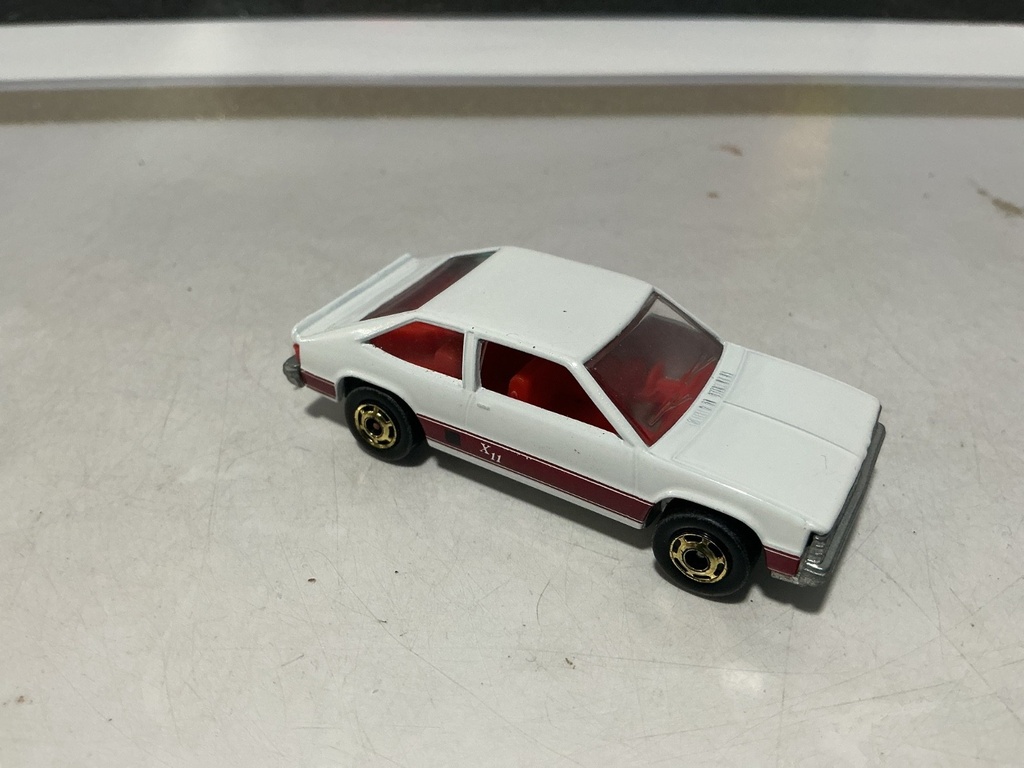 1/64 HOTWHEELS MATTEL CHEVY CITATION XII - 1980 MADE IN HONG KONG GOLD WHEELS image