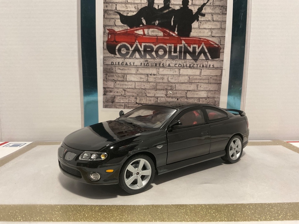 1/18: RACING CHAMPIONS ZOO4 PONTIAC GTO BLACK ON RED image
