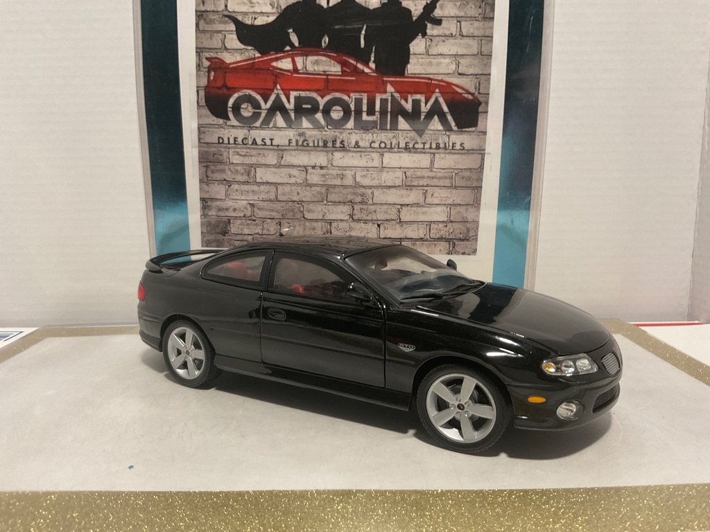 1/18: RACING CHAMPIONS ZOO4 PONTIAC GTO BLACK ON RED image