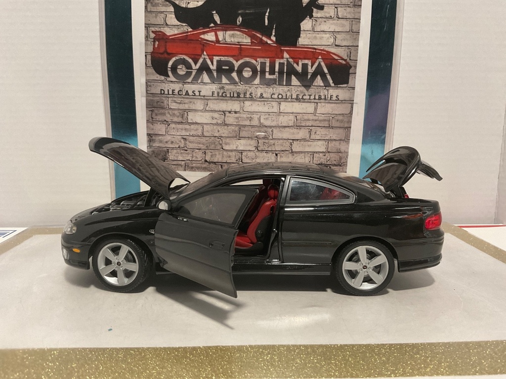 1/18: RACING CHAMPIONS ZOO4 PONTIAC GTO BLACK ON RED image