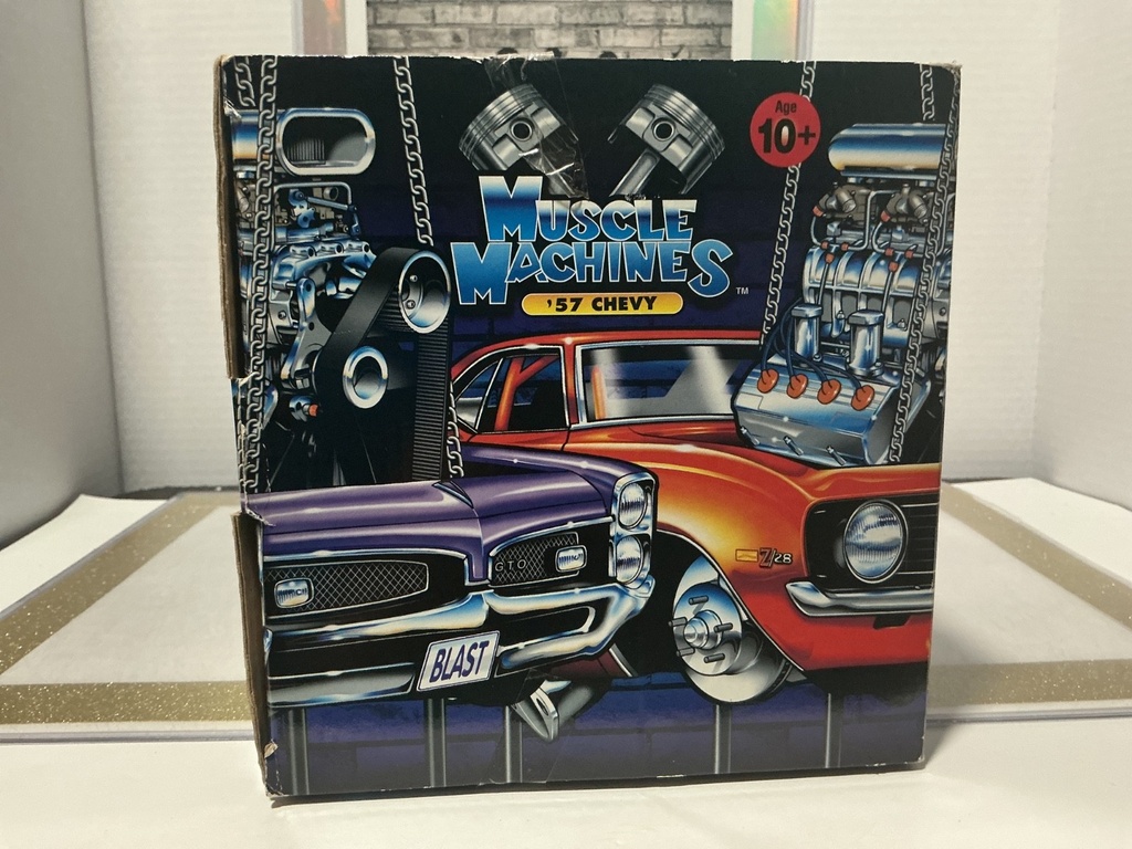 1/18: MUSCLE MACHINES WHITE W/ FLAMES ‘57 CHEVY image