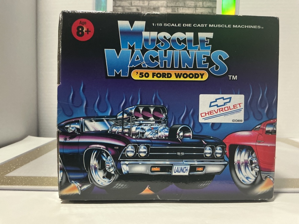 1/18: MUSCLE MACHINES RED ‘50 FORD WOODY image