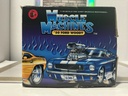 1/18: MUSCLE MACHINES RED ‘50 FORD WOODY image