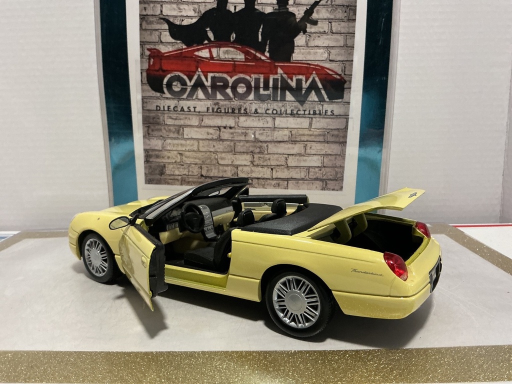 1/18: MAISTO 1999 FORD THUNDERBIRD YELLOW ON BLACK image