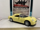 1/18: MAISTO 1999 FORD - THUNDERBIRD - YELLOW ON BLACK image