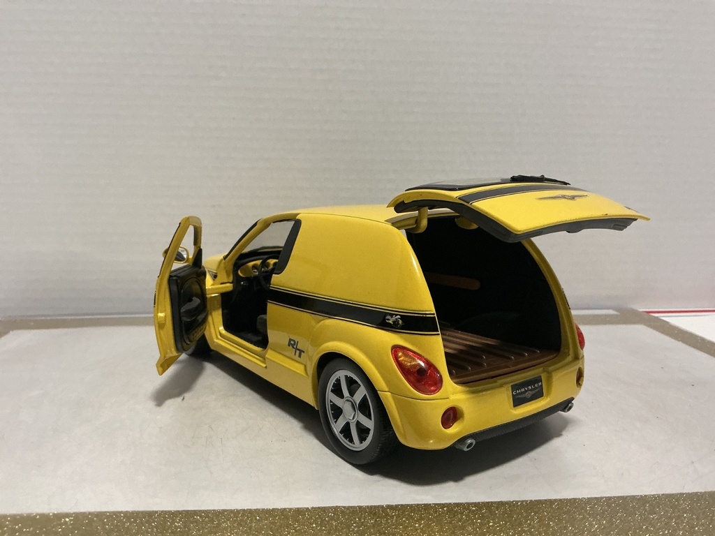 1/18 HOT WHEELS CHRYSLER PANEL CRUISER YELLOW ON BLACK image