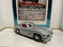 1:18 BURAGO  ITALY 1954 MERCEDES 300 SL GULLWING SILVER ON RED image