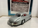 1:18 BURAGO  ITALY 1954 MERCEDES 300 SL GULLWING SILVER ON RED image