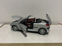 1:18 WELLY PEVGOT 206CC SILVER ON BROWN image