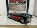 1:18 BURAGO 1957 CORVETTE PARTS CAR BLACK ON RED image