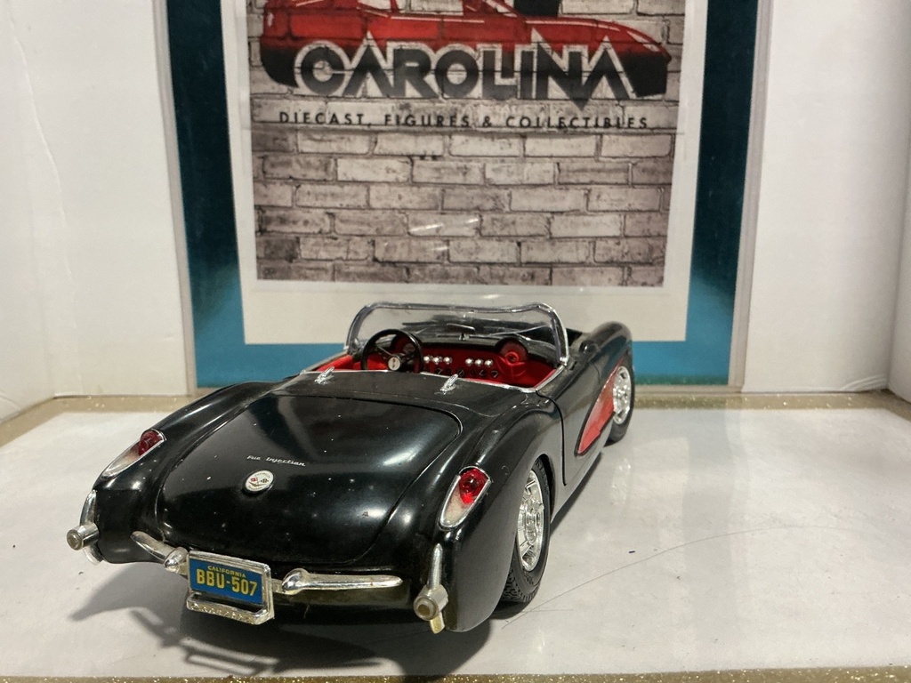 1:18 BURAGO 1957 CORVETTE PARTS CAR BLACK ON RED image
