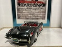 1:18 BURAGO 1957 CORVETTE PARTS CAR BLACK ON RED image