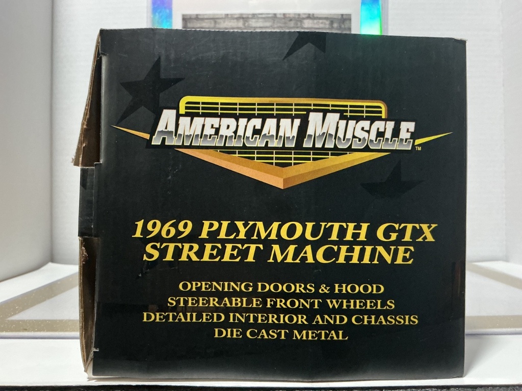 1:18 AMERICAN MUSCLE 1969 PLYMOUTH STREET MACHINE BRONZE OVER BLACK image