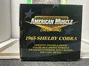 1:18 ERTL 10TH ANNIVERSARY 1965 SHELBY COBRA RED ON BLACK image