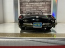1:18 BURAGO 1957 CHEVROLET CORVETTE BLACK ON RED CONVERTIBLE image