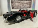 1:18 BURAGO 1957 CHEVROLET CORVETTE BLACK ON RED CONVERTIBLE image