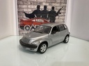 1:18 MAISTO PT CRUISER SILVER ON GREY image