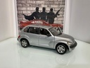 1:18 MAISTO PT CRUISER SILVER ON GREY image