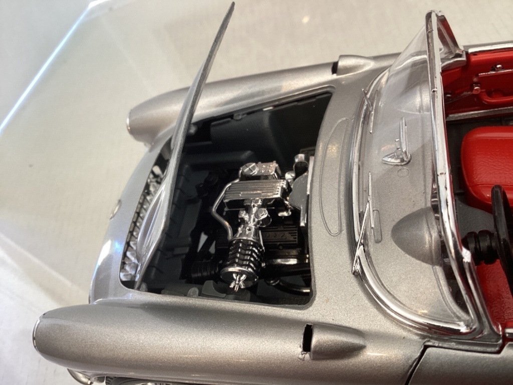 1:18 BURAGO 1957 CHEVROLET CORVETTE SILVER ON RED CONVERTIBLE image