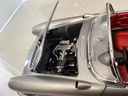 1:18 BURAGO 1957 CHEVROLET CORVETTE SILVER ON RED CONVERTIBLE image