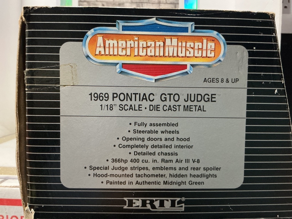 1:18 ERTL 1969 PONTIAC GTO JUDGE BLUE ON WHITE image