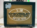 1:18 ROAD TOUGH - CHEVROLET CORVETTE 1957 DARK GRAY ON WHITE image