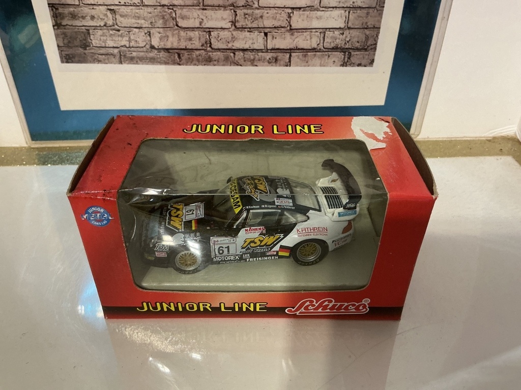 1:43 SCHUCO JUNIOR LINE PORSHE # 61 TSW BOX IMPERFECT image