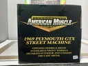 1:18 ERTL 1969 PLYMOUTH GTX STREET MACHINE BRONZE / BLACK image