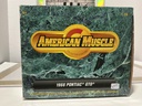 1:18 ERTL - 1966 PONTIAC GTO AMERICAN MUSCLE BLACK ON RED image