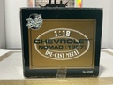 1:18 ROAD TOUGH 1957 CHEVROLET NOMAD BLACK ON RED image