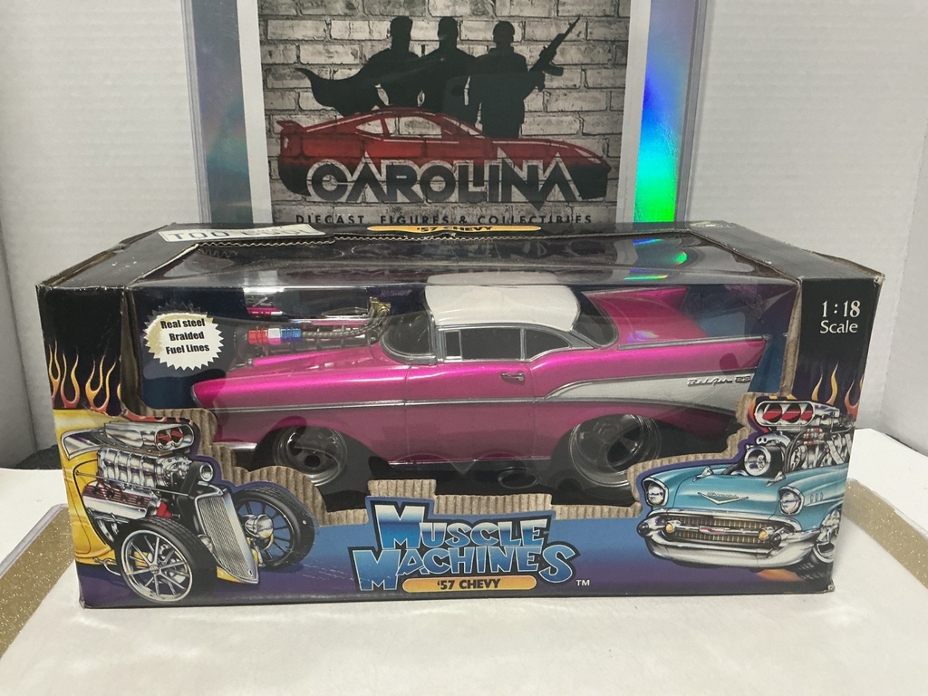 1/18: MUSCLE MACHINES PINK / WHITE ‘57 CHEVY [WATER DAMAGE TO BOX]