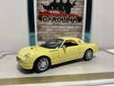 1/18: MAISTO 1999 FORD - THUNDERBIRD - YELLOW ON BLACK