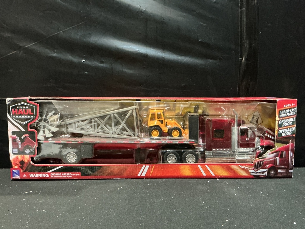 [103260] NEW RAY - LONG HAULER TRUCKER PETERBILT 389 FLATBED