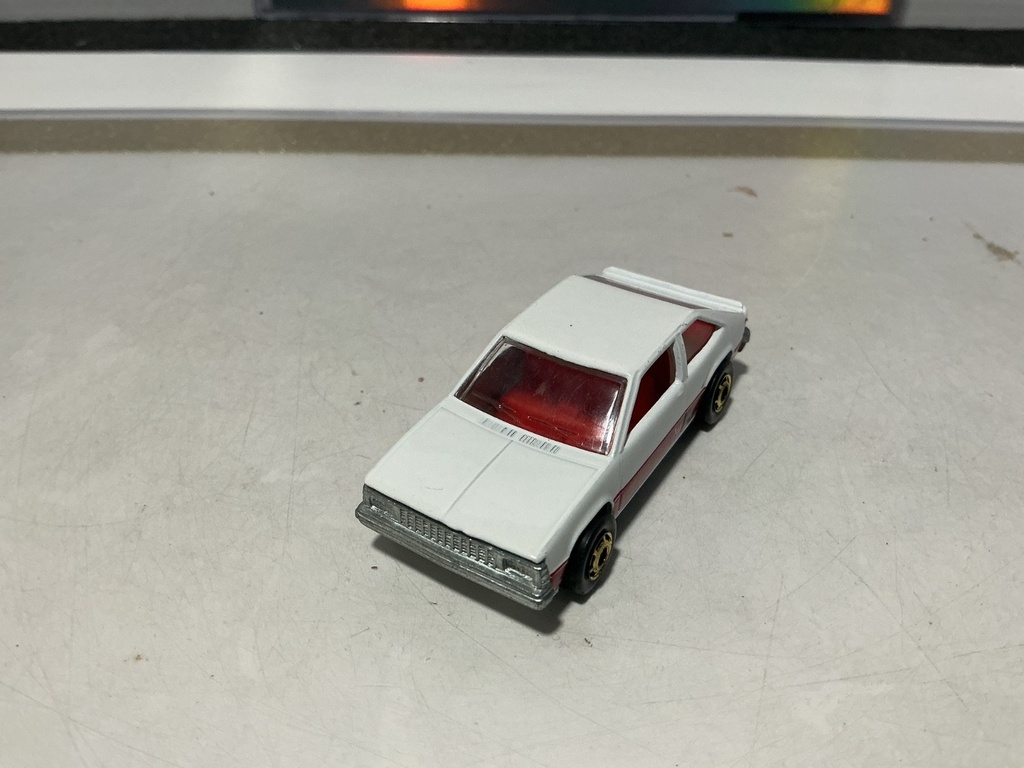 1/64 HOTWHEELS MATTEL CHEVY CITATION XII - 1980 MADE IN HONG KONG GOLD WHEELS