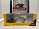 1/32 NORSCOT CAT 302.5 MINI HYDRAULIC EXCAVATOR WITH WORK TOOLS MISSING ONE