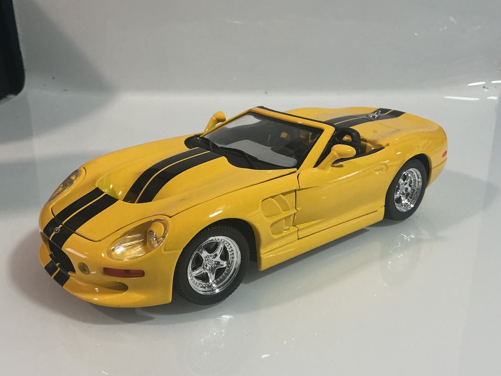 1/18 ROAD SIGNATURE 1999 SHELBY SERIES 1 YELLOW / BLACK ON GREY
